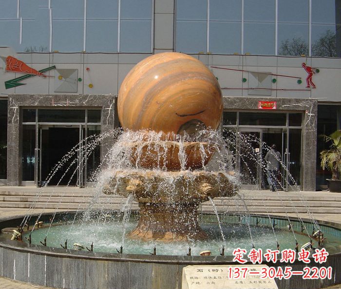 运城石来运转球晚霞红风水球石雕